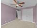 Bedroom featuring carpet, ceiling fan, closet, and ample natural light at 1144 Dexter Ridge Dr, Holly Springs, NC 27540