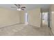 Spacious bedroom featuring a ceiling fan and neutral carpeting, ready for personal touches at 1144 Dexter Ridge Dr, Holly Springs, NC 27540