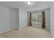 Bright bedroom with carpet floors, a window, and a closet providing comfort and functionality at 1144 Dexter Ridge Dr, Holly Springs, NC 27540