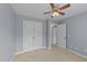 Bedroom with carpet, ceiling fan, and closet at 1144 Dexter Ridge Dr, Holly Springs, NC 27540