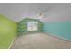 Colorful bedroom featuring zig-zag design, carpet floors, a window, and ceiling fan at 1144 Dexter Ridge Dr, Holly Springs, NC 27540