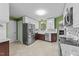 Modern kitchen with stainless steel appliances, white cabinets, and sleek countertops at 1144 Dexter Ridge Dr, Holly Springs, NC 27540