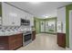 Bright, updated kitchen boasts stainless appliances and a charming breakfast nook area at 1144 Dexter Ridge Dr, Holly Springs, NC 27540