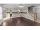 Bright living room features hardwood floors, archways and a staircase at 1144 Dexter Ridge Dr, Holly Springs, NC 27540