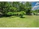 Lush backyard featuring a charming pergola, perfect for relaxation and outdoor enjoyment at 125 Green Ln, Clayton, NC 27520
