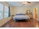 Bright bedroom featuring hardwood floors, ample natural light from windows, and neutral wall color at 125 Green Ln, Clayton, NC 27520