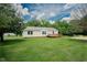 Ranch style home with green lawn and deck at 125 Green Ln, Clayton, NC 27520