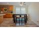 Bright kitchen dining area featuring wood floors, a stone backsplash, and modern appliances at 125 Green Ln, Clayton, NC 27520