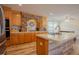 Modern kitchen with an island, stainless appliances, and a stone backsplash creates a stylish space at 125 Green Ln, Clayton, NC 27520