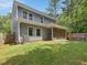 This beautiful backyard features a large lawn, nice landscaping, and privacy fence at 128 Chapel Run Way, Chapel Hill, NC 27517