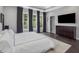 Bright bedroom with ample natural light, dark hardwood floors, and stylish gray accents at 128 Chapel Run Way, Chapel Hill, NC 27517