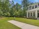 Beautiful home featuring a lush green lawn with an inviting walkway at 128 Chapel Run Way, Chapel Hill, NC 27517