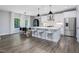 Bright, open kitchen with modern appliances, a stylish island, and dining area, perfect for entertaining at 128 Chapel Run Way, Chapel Hill, NC 27517