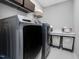 This spacious laundry room has a modern washer and dryer, plus storage at 128 Chapel Run Way, Chapel Hill, NC 27517