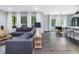 Bright living room with ample natural light, featuring a comfortable sectional sofa and open-concept design at 128 Chapel Run Way, Chapel Hill, NC 27517