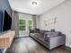 Cozy loft space featuring a comfortable sofa, large windows, and minimalist decor, perfect for relaxation at 128 Chapel Run Way, Chapel Hill, NC 27517