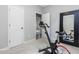 This room is a home gym and has neutral carpets and paint at 128 Chapel Run Way, Chapel Hill, NC 27517