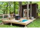 Outdoor deck with chairs, table, and a yoga mat at 1403 Meadow Ln, Chapel Hill, NC 27516