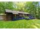 Backyard view of the property with a blue deck at 1403 Meadow Ln, Chapel Hill, NC 27516