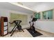 Home gym with free weights and a stationary bicycle at 1403 Meadow Ln, Chapel Hill, NC 27516