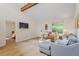 Comfortable living room showcasing hardwood flooring and a modern open-concept design at 1403 Meadow Ln, Chapel Hill, NC 27516