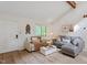 Cozy living room featuring neutral tones, comfortable seating, and natural wood-look floors at 1403 Meadow Ln, Chapel Hill, NC 27516