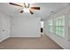 A bright bedroom featuring neutral carpet and two windows letting in ample natural light at 1434 Salem Dr, Apex, NC 27502