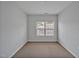 Upstairs bedroom with standard carpet and one window at 1434 Salem Dr, Apex, NC 27502