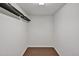 A well-lit storage area or closet featuring wooden floors and bright track lighting at 1434 Salem Dr, Apex, NC 27502