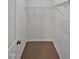 Walk-in closet featuring ample storage with wire shelving and neutral carpet at 1434 Salem Dr, Apex, NC 27502