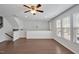 Bright living room boasting hardwood floors, large windows, and an open layout at 1434 Salem Dr, Apex, NC 27502