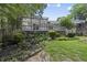 Lovely backyard featuring a wooden deck and beautiful landscaping with lush greenery and flower beds at 1500 Laureldale Dr, Raleigh, NC 27609