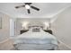 Cozy bedroom with ceiling fan, neutral colors, and a modern design at 1500 Laureldale Dr, Raleigh, NC 27609