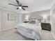 Cozy bedroom featuring plush carpeting, a ceiling fan, and a comfortably made bed at 1500 Laureldale Dr, Raleigh, NC 27609