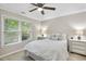 Bright bedroom with ceiling fan, neutral colors, and a window for natural light at 1500 Laureldale Dr, Raleigh, NC 27609