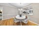 Charming dining area with hardwood floors and an elegant chandelier at 1500 Laureldale Dr, Raleigh, NC 27609