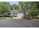 Charming exterior featuring a garage and lush landscaping, enhancing the curb appeal at 1500 Laureldale Dr, Raleigh, NC 27609