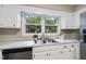 Traditional kitchen with stainless steel appliances and a view of the backyard at 1500 Laureldale Dr, Raleigh, NC 27609