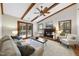 Bright living room boasts a fireplace, ceiling fan, and windows at 1500 Laureldale Dr, Raleigh, NC 27609