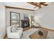 Comfortable living room showcases a fireplace and natural light from the windows at 1500 Laureldale Dr, Raleigh, NC 27609