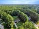 Single-story home with long drive sits on a large wooded lot providing privacy at 1515 Bradsher Dr, Stem, NC 27581