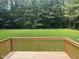 Expansive backyard view from a wooden deck, offering privacy and a serene natural setting at 1515 Bradsher Dr, Stem, NC 27581