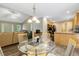 Cozy dining area with natural light and views into the kitchen at 1515 Bradsher Dr, Stem, NC 27581