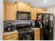 Kitchen with stainless steel appliances and wooden cabinetry at 1515 Bradsher Dr, Stem, NC 27581