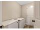 Bright laundry area features practical vinyl flooring and includes two chest freezers for extra storage at 1515 Bradsher Dr, Stem, NC 27581