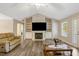 Inviting living room with built-in shelving, fireplace, and neutral wall color at 1515 Bradsher Dr, Stem, NC 27581