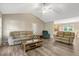 Spacious living room with vaulted ceiling, neutral walls, and hardwood-style floors at 1515 Bradsher Dr, Stem, NC 27581
