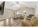 Spacious living room features vaulted ceilings, vinyl flooring, lots of natural light, and an open layout at 1515 Bradsher Dr, Stem, NC 27581