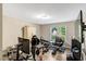 Office space with vinyl flooring, built-in cabinets, large window, and plenty of room for a desk and equipment at 1515 Bradsher Dr, Stem, NC 27581
