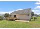 Backyard featuring a deck, gravel, grass and a black metal fence at 21 Cambridge Dr, Angier, NC 27501
